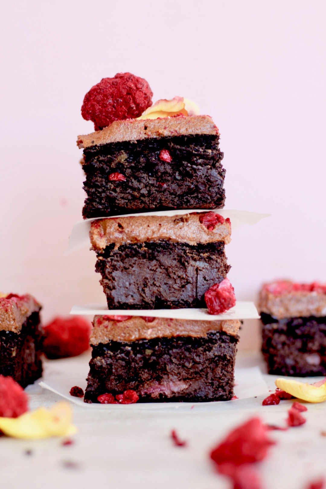 stacked pieces of easy vegan chocolate berry brownie