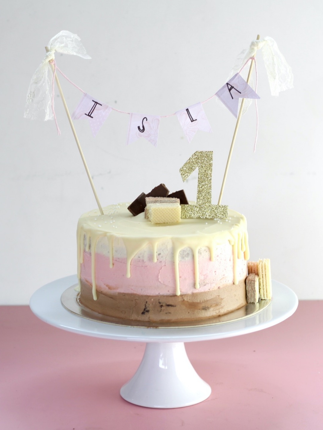 neapolitan layer cake on cake stand