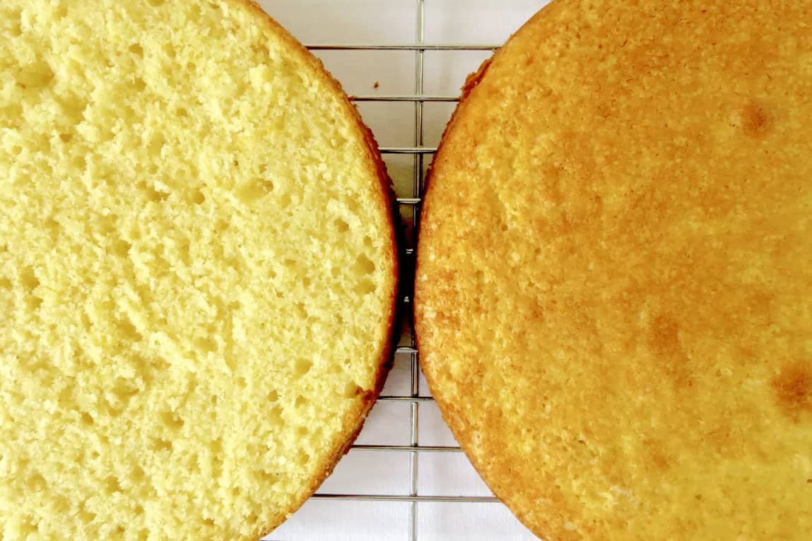 Baked vanilla cake layers using the creaming method. One layer showcases the bubbles created from this method.