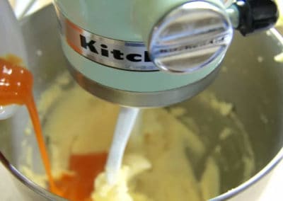 Adding eggs to the creamed mixture