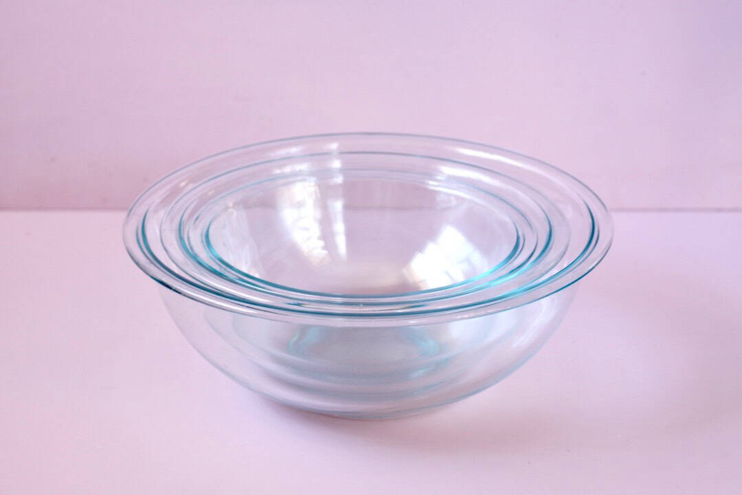 Three glass mixing bowls stacked inside each other