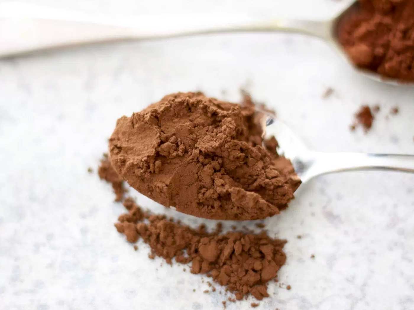 Natural cocoa powder on a spoon