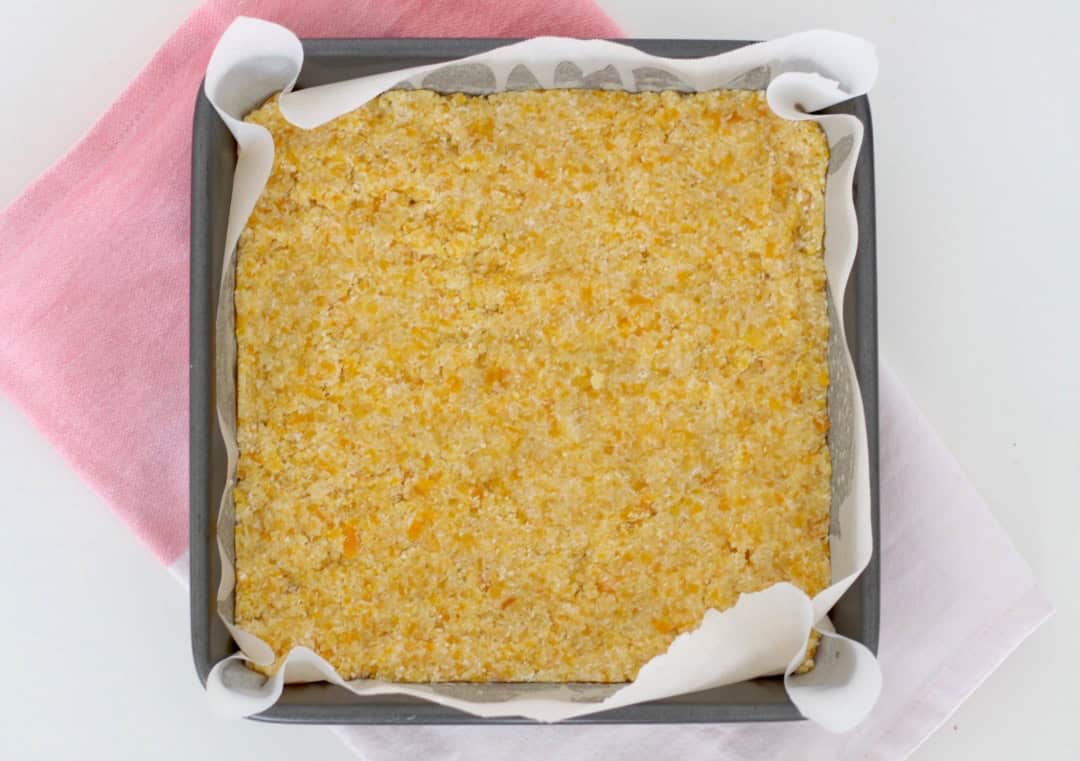 A batch of slice in the tin with baking paper