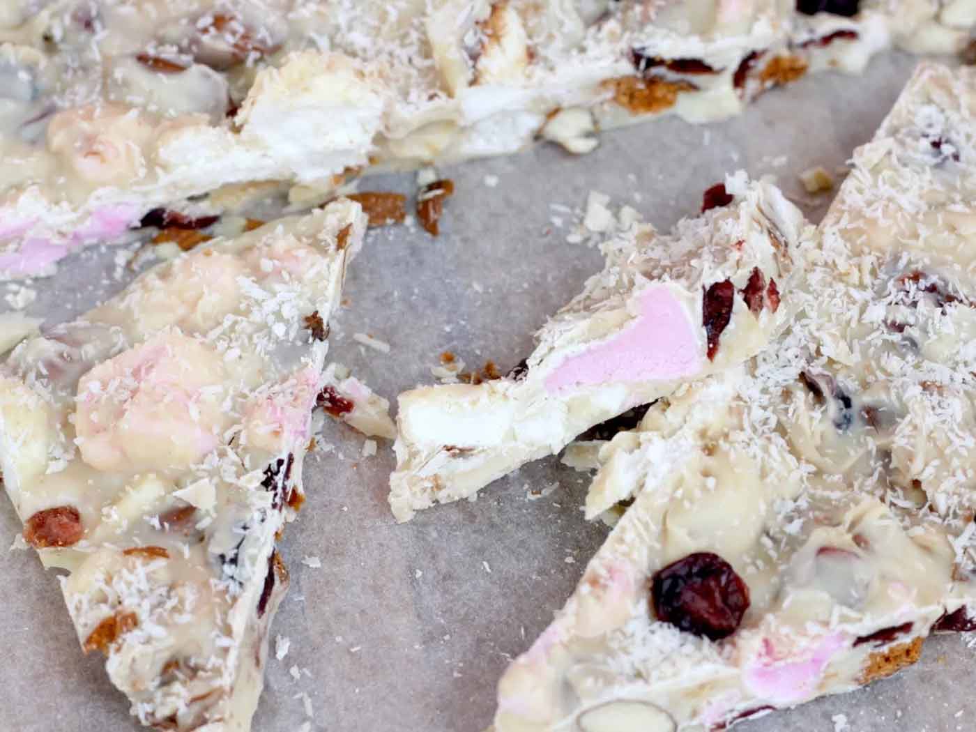 Cut up pieces of white chocolate rocky road on baking paper