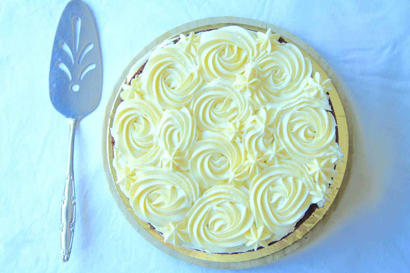 Birds eye view of the chocolate zucchini cake. Piped rosettes on top.