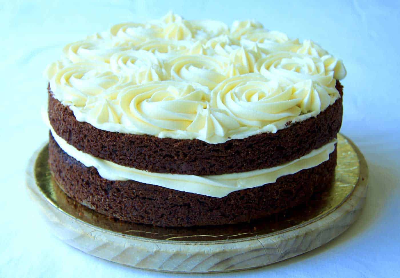Side view of decorated two layer chocolate zucchini cake.