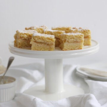 Pieces of apple shortcake on a cake stand.