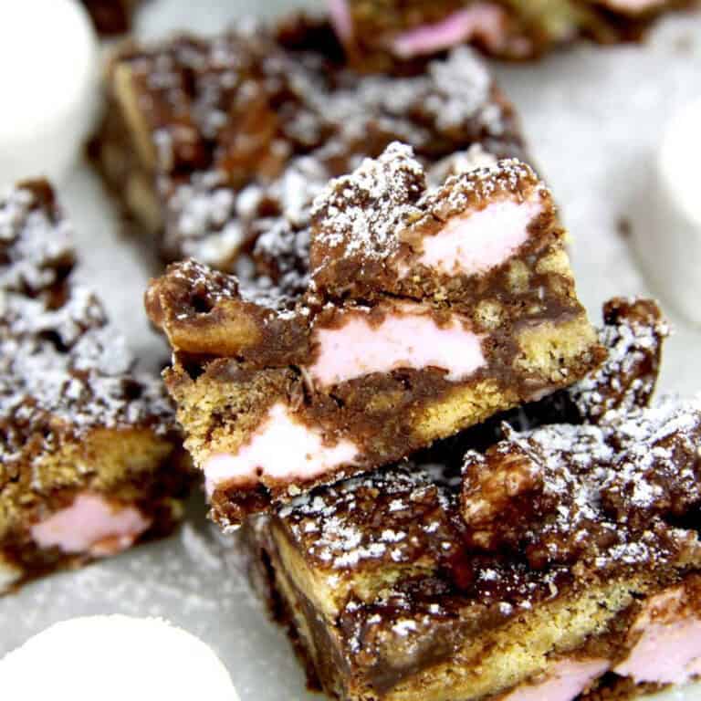 A few pieces of rocky road on a plate.