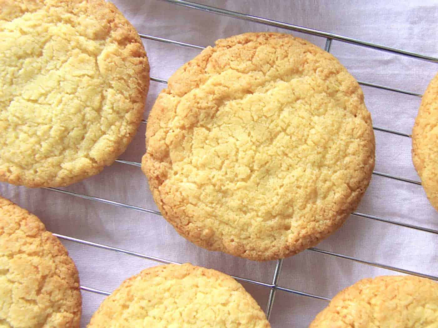 Lemon coconut cookies cooling on a wire rack.