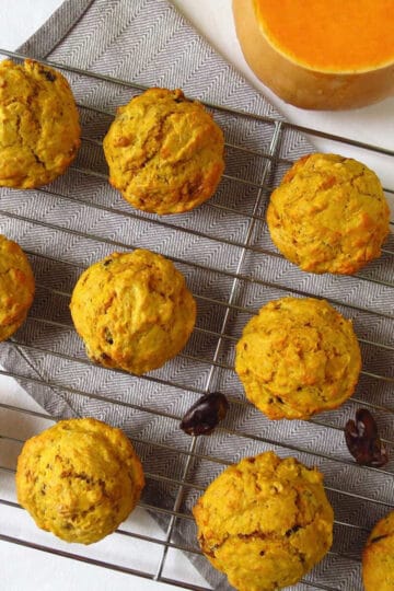 Yummy pumpkin and date muffins on a cooling rack.