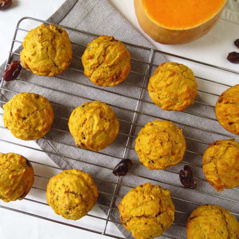 Yummy pumpkin and date muffins on a cooling rack.