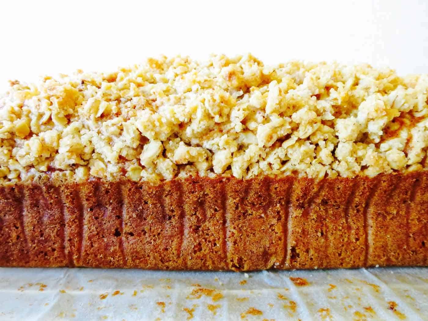 Side view of spiced pumpkin bread with crumble topping.