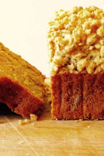 Sliced pumpkin bread with crumble topping.