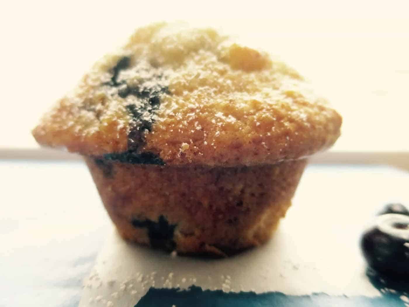 Stand along blueberry lemon muffin with the perfect muffin top.