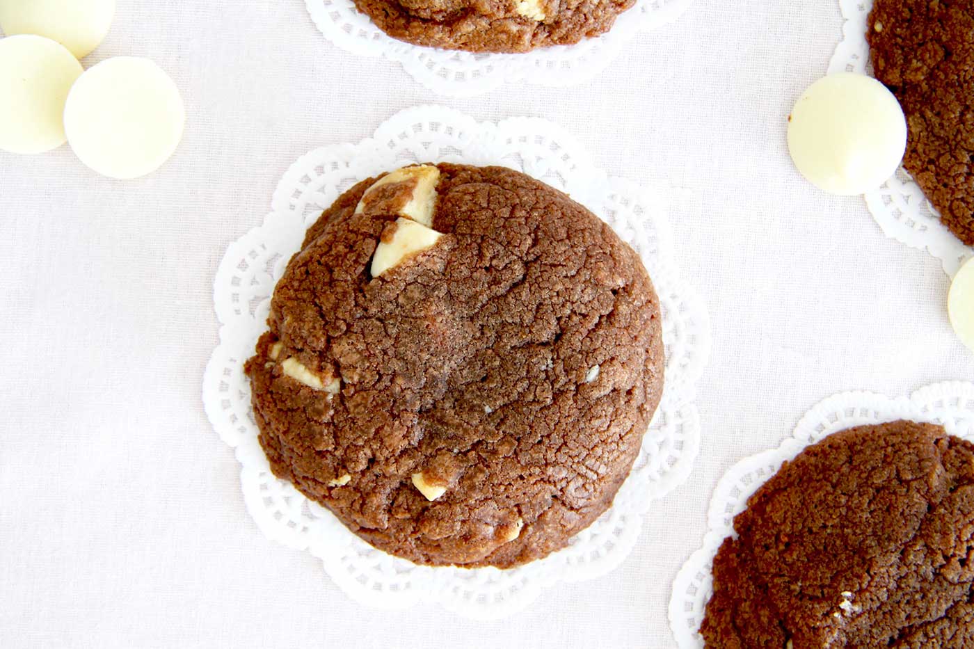 Birds eye view of Nutella cookies on doilies.