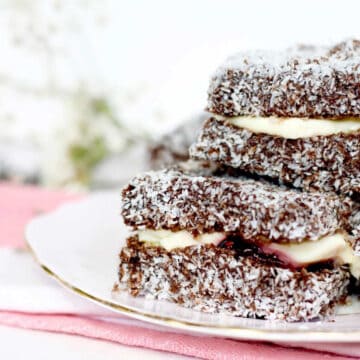 A plate of moorish chocolate lamingtons filled with raspberry cream.