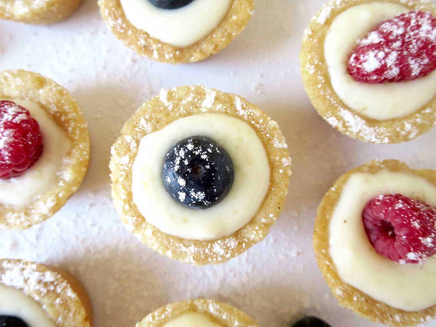 Moorish mini shortbread cases filled with lemon curd and topped with a fresh blueberry or raspberry. So cute and delicious!