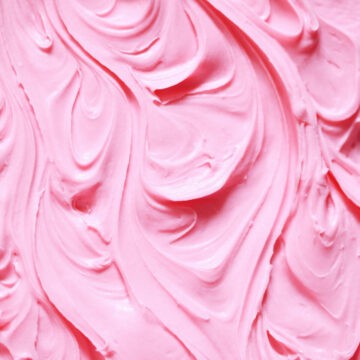 Creamy bright pink buttercream, swirled in patterns.