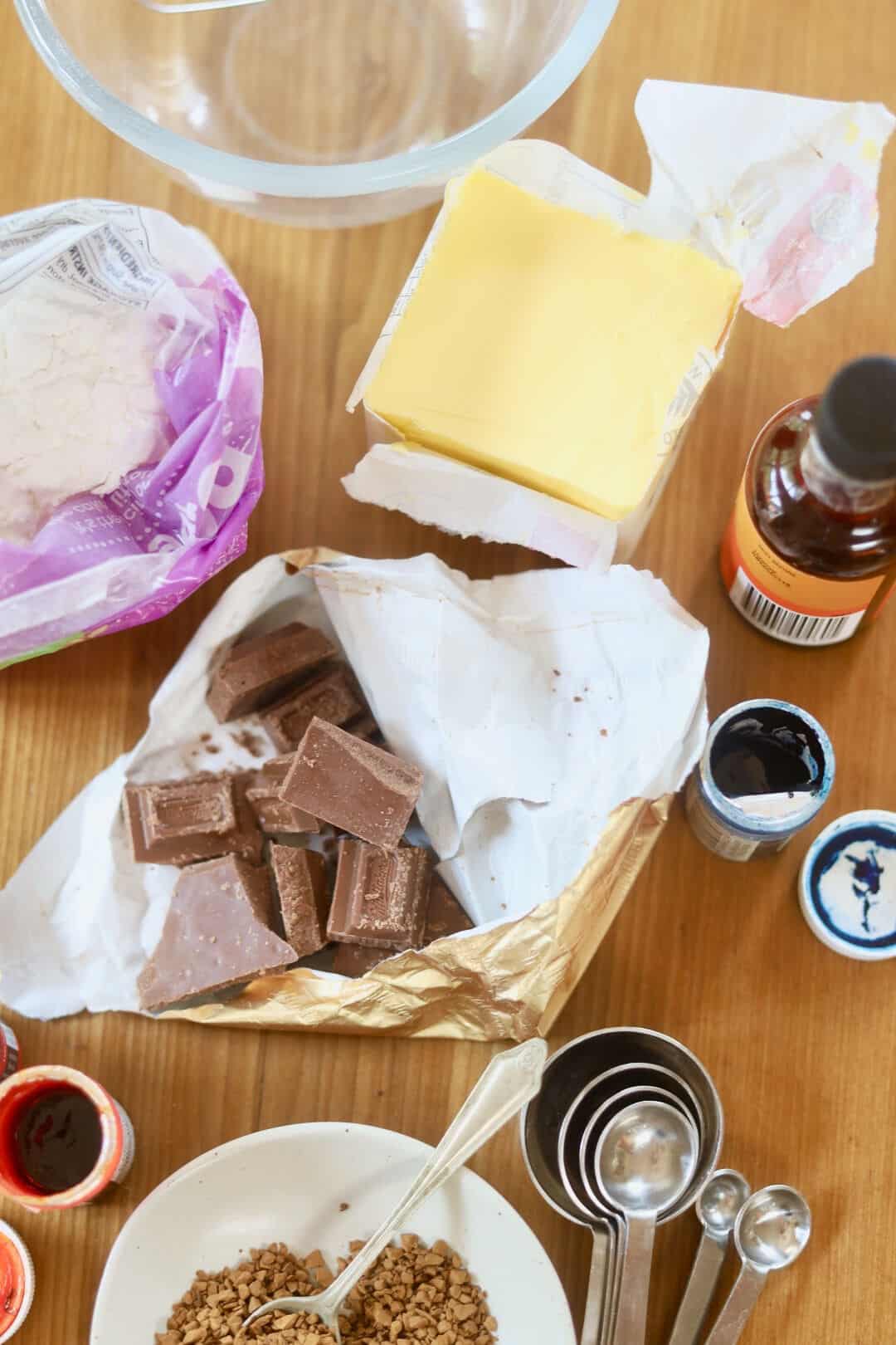 Buttercream flavourings and ingredients on a board, ready to be used.