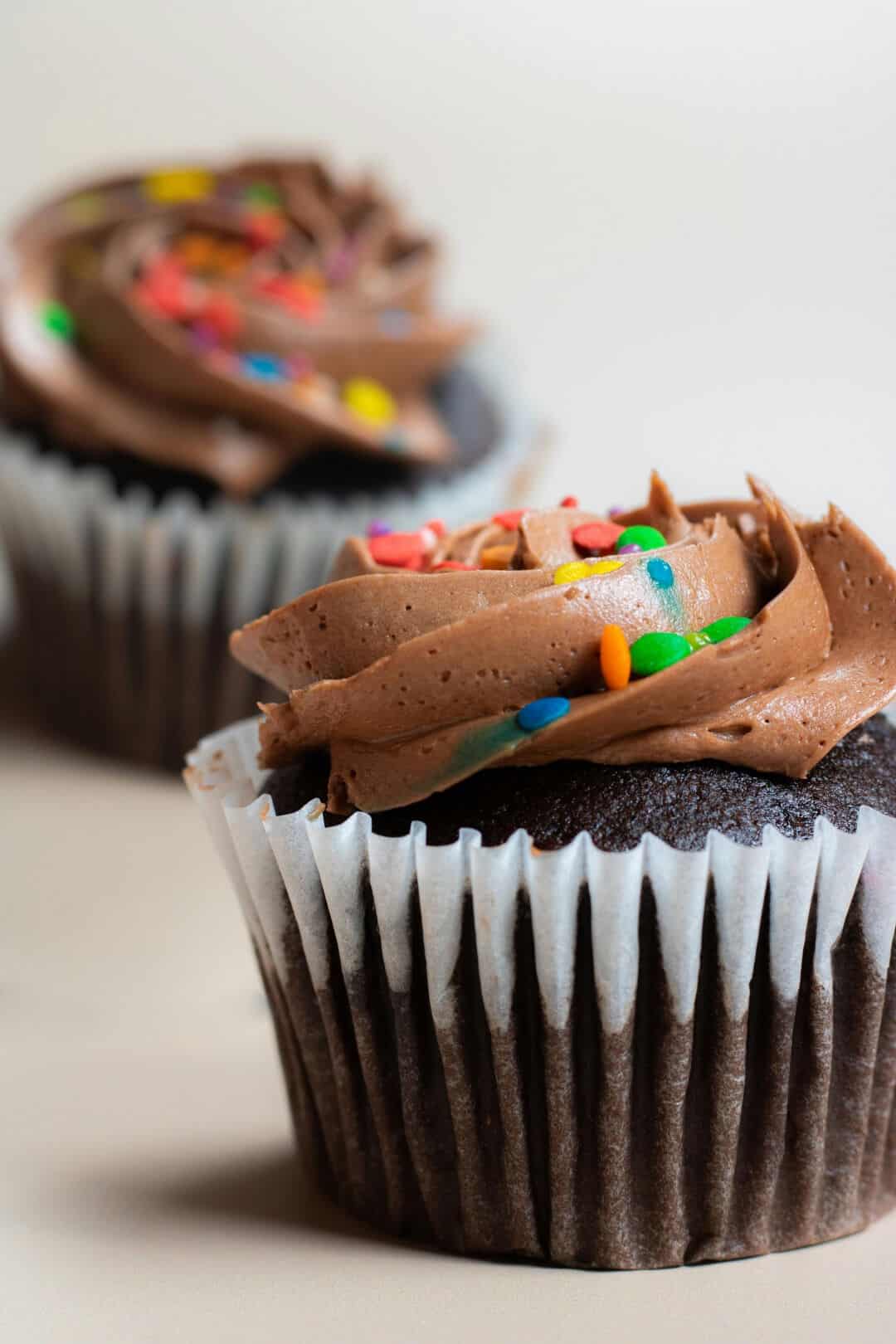 how to make perfect buttercream A rich chocolate cupcake with a creamy chocolate ganache buttercream swirled on top.