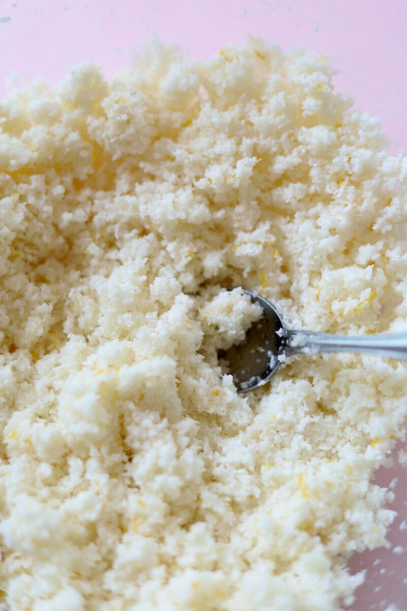 Lemon coconut truffle mixture with large pieces of lemon zest mixed in.