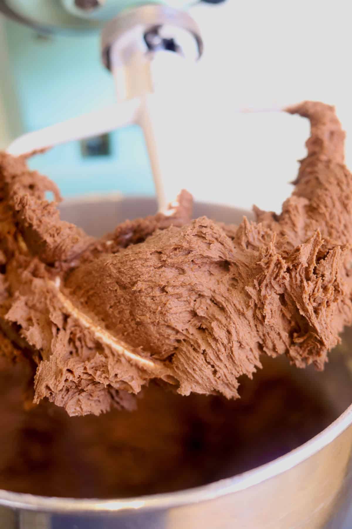 Perfectly creamy chocolate buttercream in a cake mixer, ready for piping.