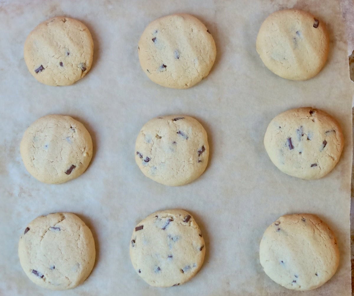 A tray of perfectly baked chocolate chip cookies.